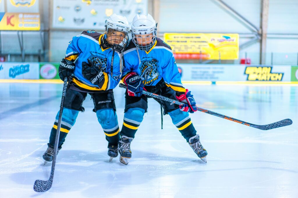 Photo by Alex P: https://www.pexels.com/photo/two-women-playing-ice-hockey-12944640/